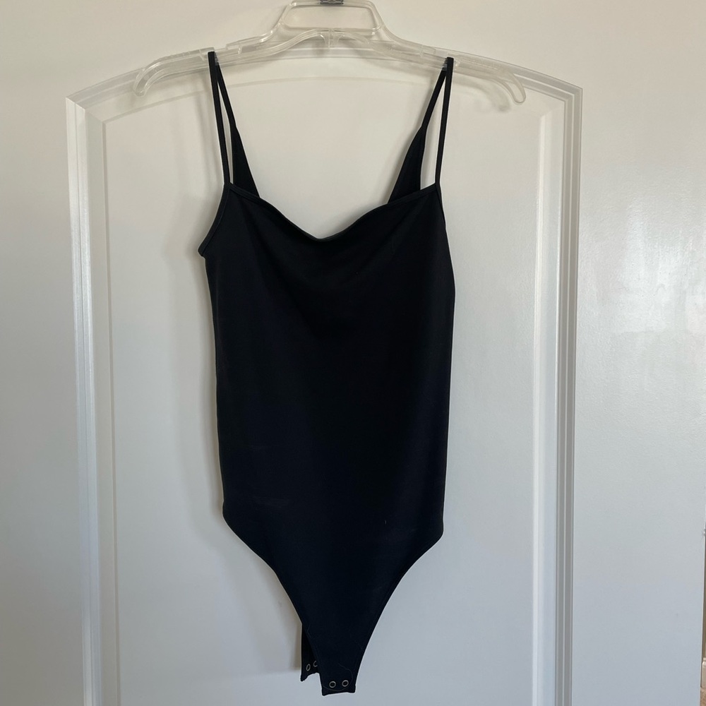 Black tank top bodysuit, never worn. Size medium